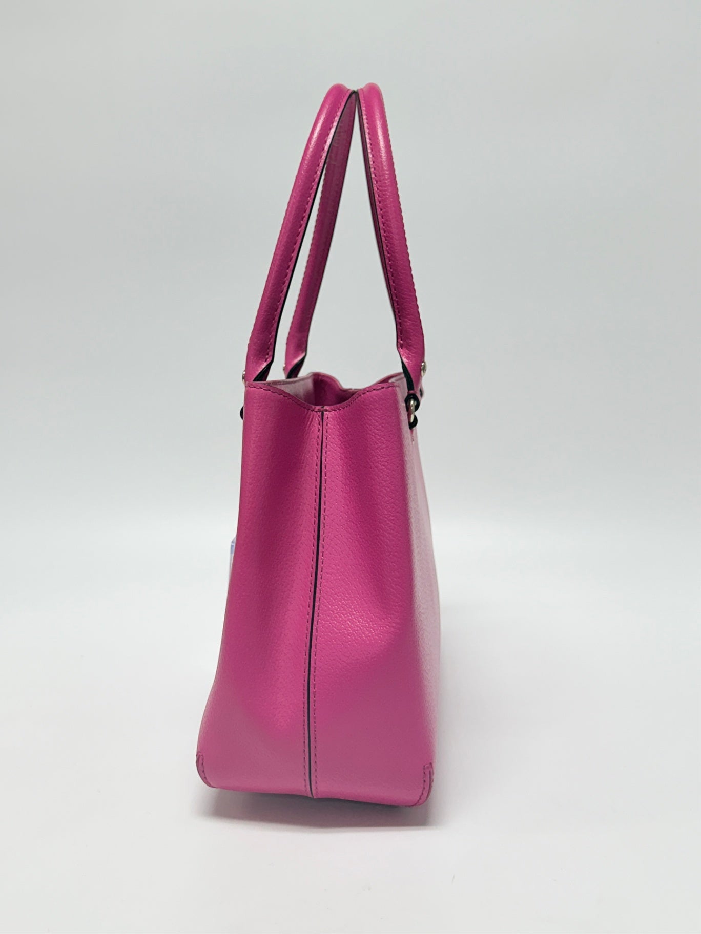 Lynn's Closet Boutique Kate Spade New York hot pink leather tote bag, side view showing structured silhouette.