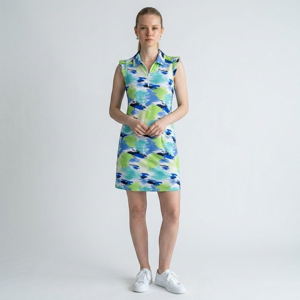 Model wearing a Lynn's Closet Boutique Ibkul sleeveless polo dress with a green and blue abstract brushstroke print.