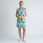 Model wearing a Lynn's Closet Boutique Ibkul sleeveless polo dress with a green and blue abstract brushstroke print.