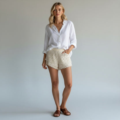 Lynn's Closet Boutique ivory lace shorts with scalloped hem and tiered detailing, size L.