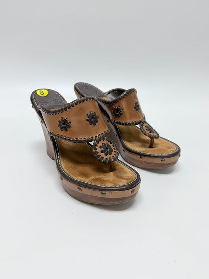 Lynn's Closet Boutique Jack Rogers brown leather wedge sandals with signature whipstitch and floral cut-out details.