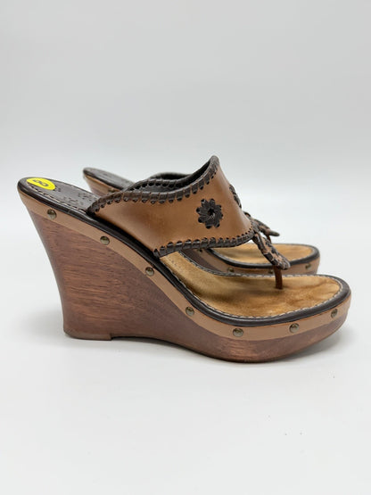 Lynn's Closet Boutique Jack Rogers brown leather wedge sandals with signature whipstitch and floral cut-out details.