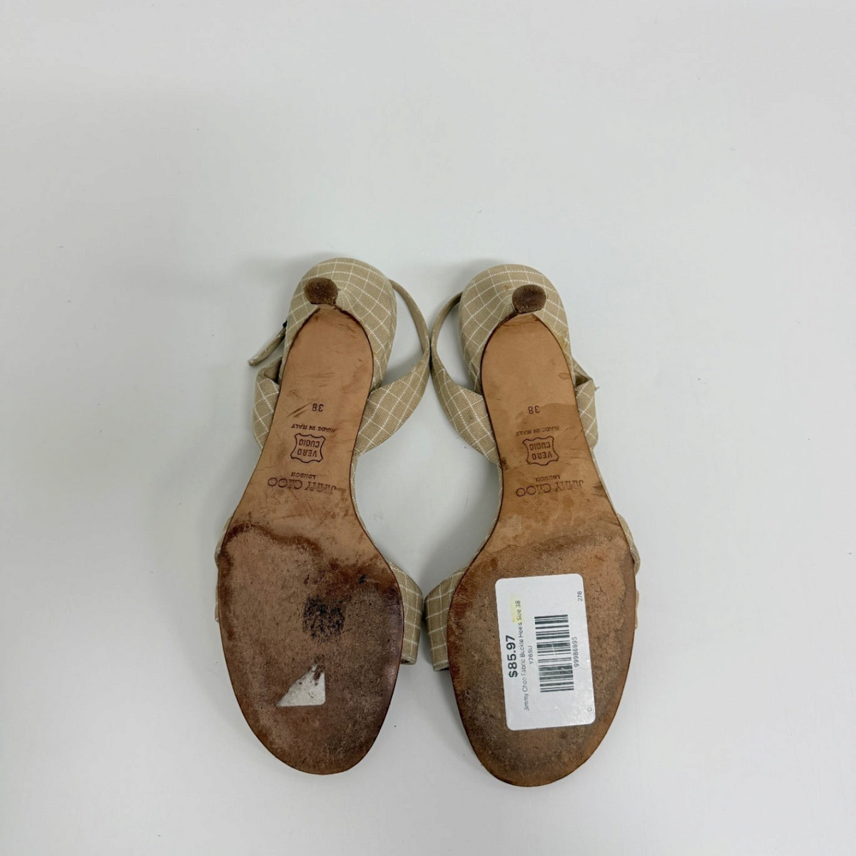 Lynn's Closet Boutique pre-owned Jimmy Choo beige grid fabric slingback kitten heels, size 38, shown from the soles.