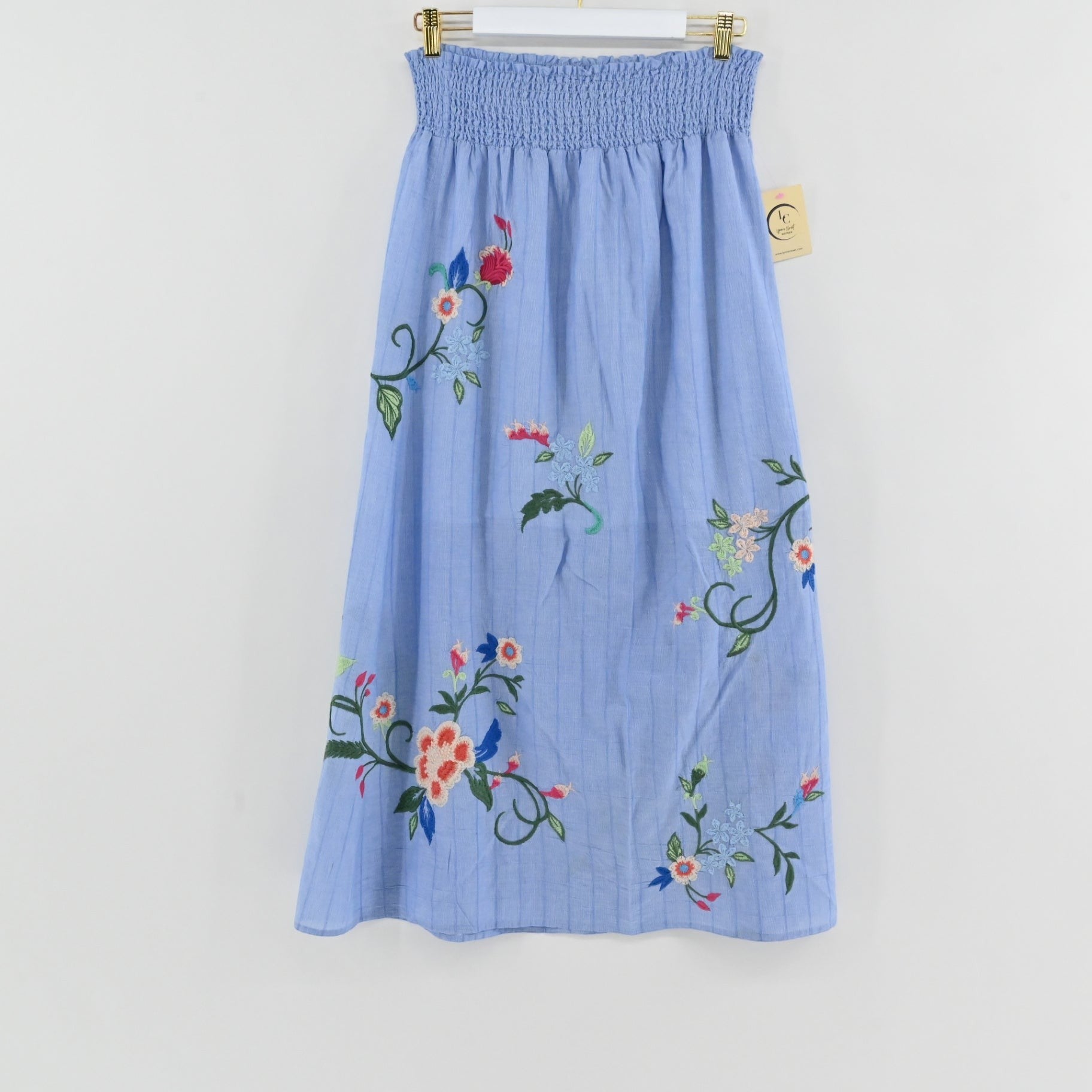 Lynn's Closet Boutique Johnny Was sky-blue maxi skirt with vibrant floral embroidery and a smocked waistband.