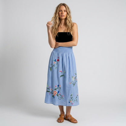 Lynn's Closet Boutique Johnny Was sky-blue maxi skirt with floral embroidery and smocked waistband worn by a model