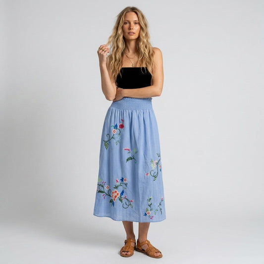 Lynn's Closet Boutique Johnny Was sky-blue maxi skirt with floral embroidery and smocked waistband worn by a model