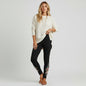Model wearing Lynn's Closet Boutique Johnny Was black leggings with floral embroidery and geometric motifs.