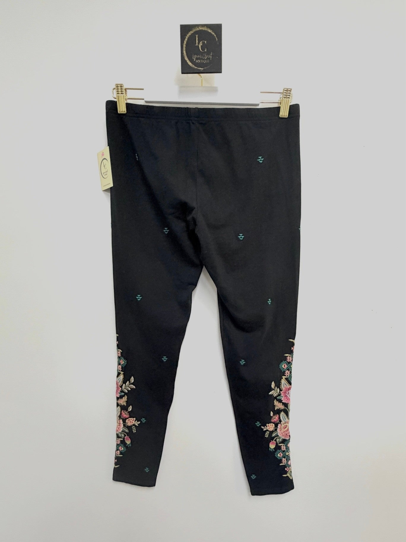 Lynn's Closet Boutique Johnny Was black leggings with colorful floral embroidery and geometric motifs, size M.