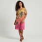 Lynn's Closet Boutique Johnny Was floral swing dress with a yellow to pink gradient and short sleeves on a model
