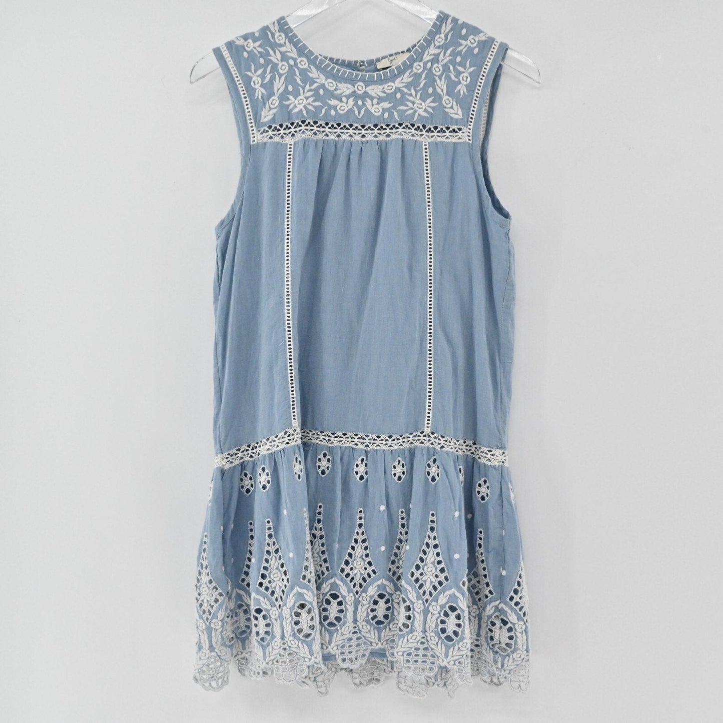 Lynn's Closet Boutique dusty blue Joie mini dress with white floral embroidery, eyelet lace hem, and ladder-stitch trim.