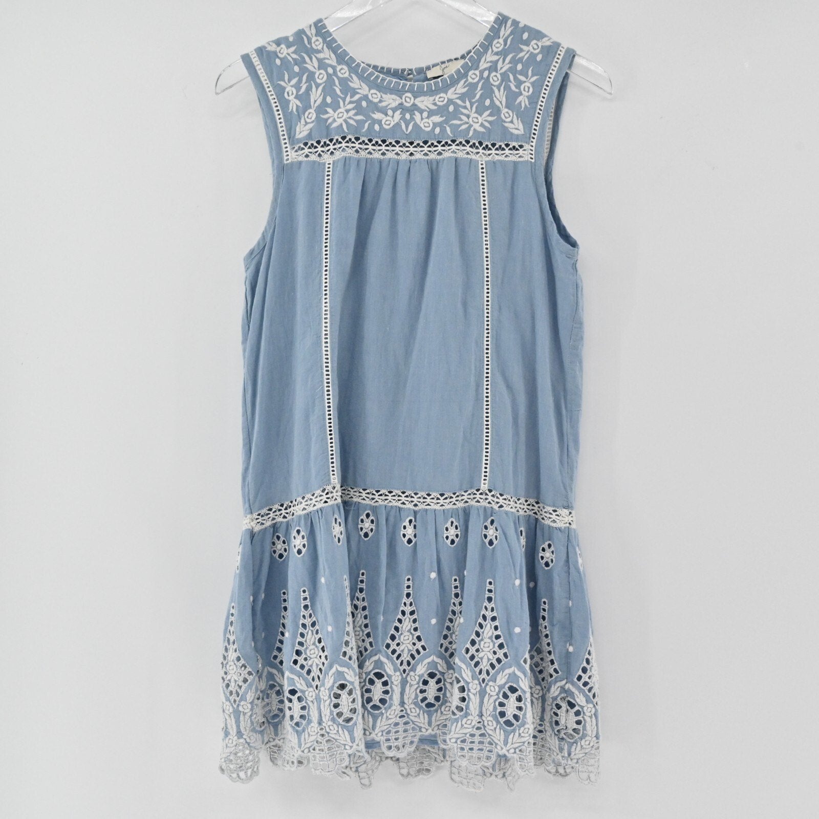 Lynn's Closet Boutique dusty blue Joie mini dress with white floral embroidery, eyelet lace hem, and ladder-stitch trim.