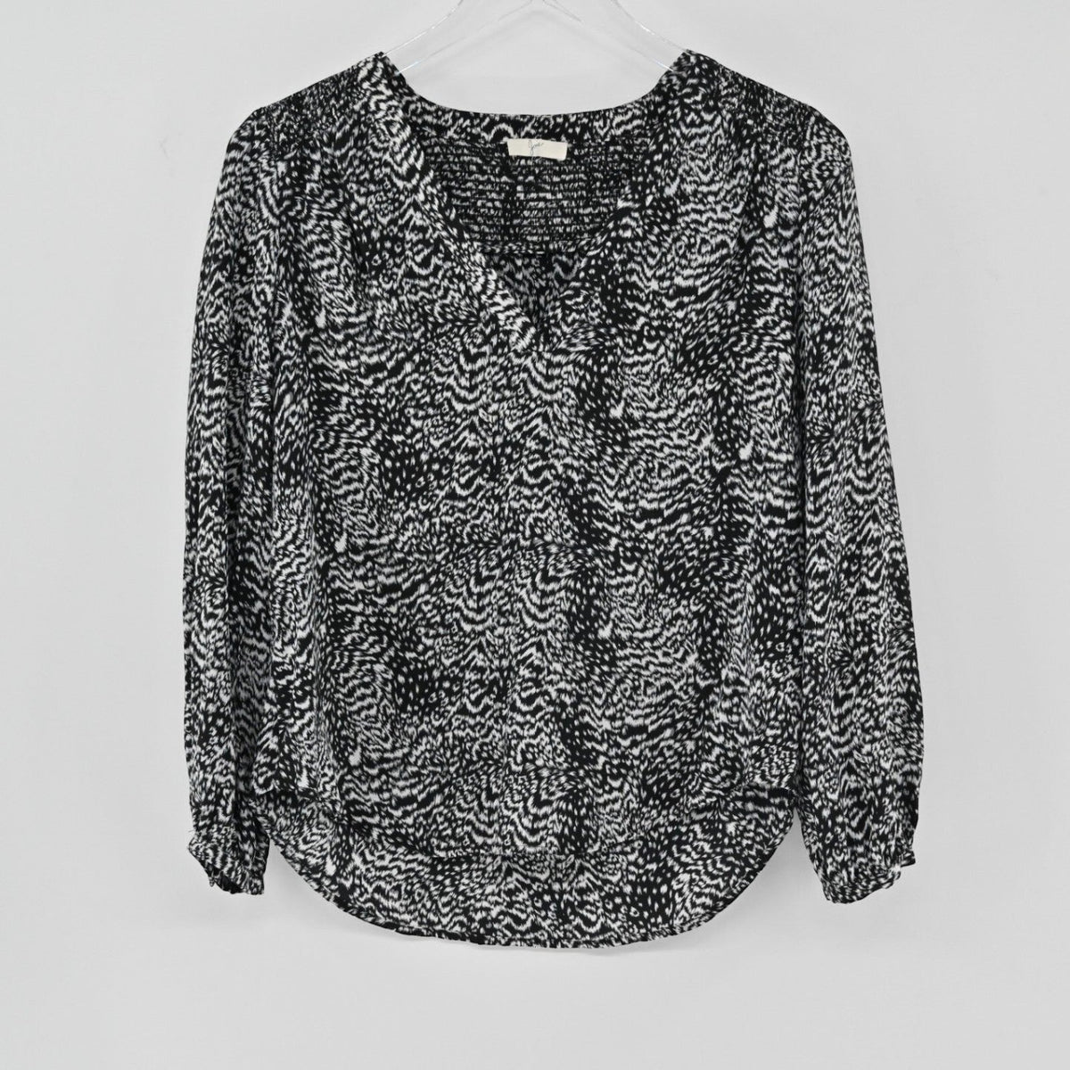 Lynn's Closet Boutique Joie black and white animal print silk blouse with V-neckline and long sleeves