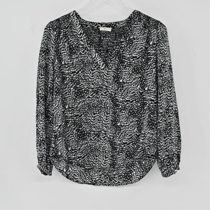 Lynn's Closet Boutique Joie black and white animal print silk blouse with V-neckline and long sleeves