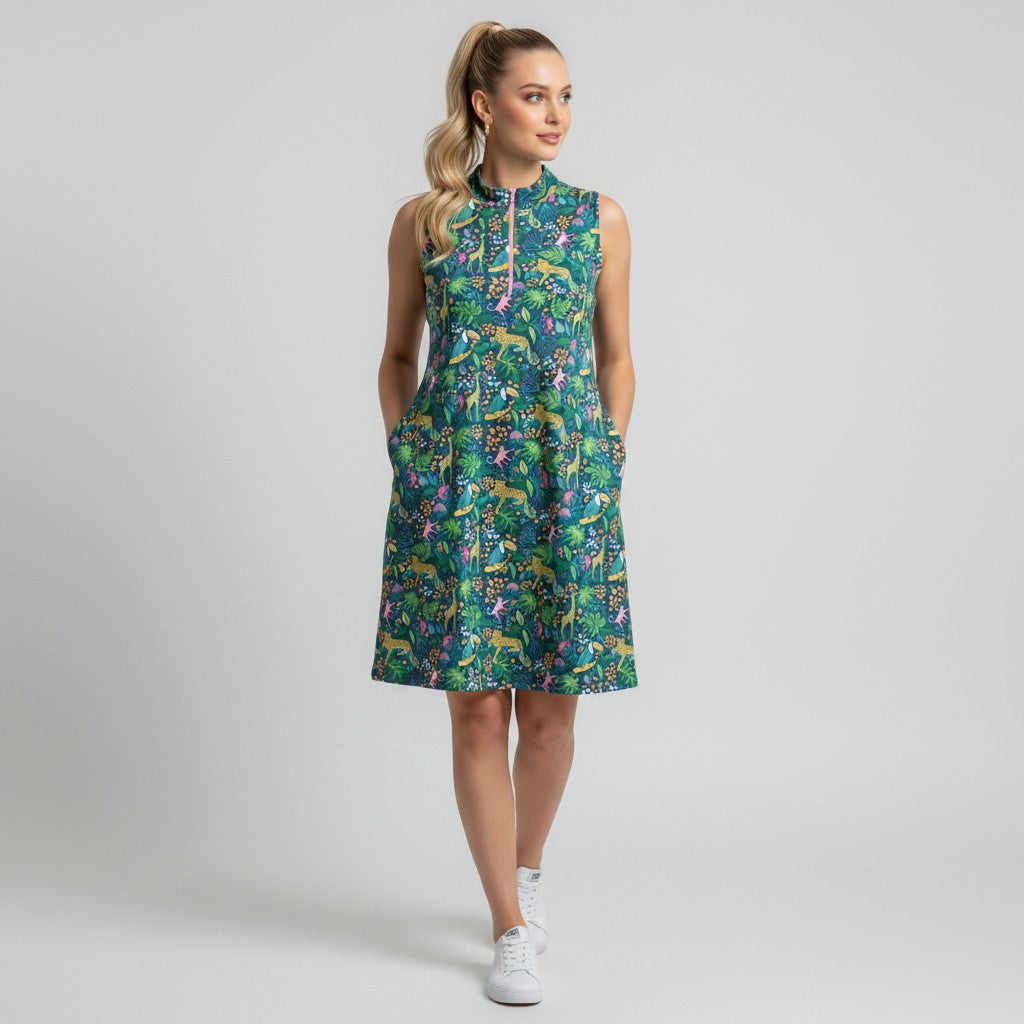 Model wearing a Lynn's Closet Boutique Katherine Way sleeveless jungle print dress with a pink zipper and pockets.