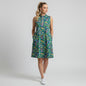 Model wearing a Lynn's Closet Boutique Katherine Way sleeveless jungle print dress with a pink zipper and pockets.