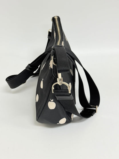 Lynn's Closet Boutique Kate Spade Chelsea nylon crossbody bag in black with white apple print, side view