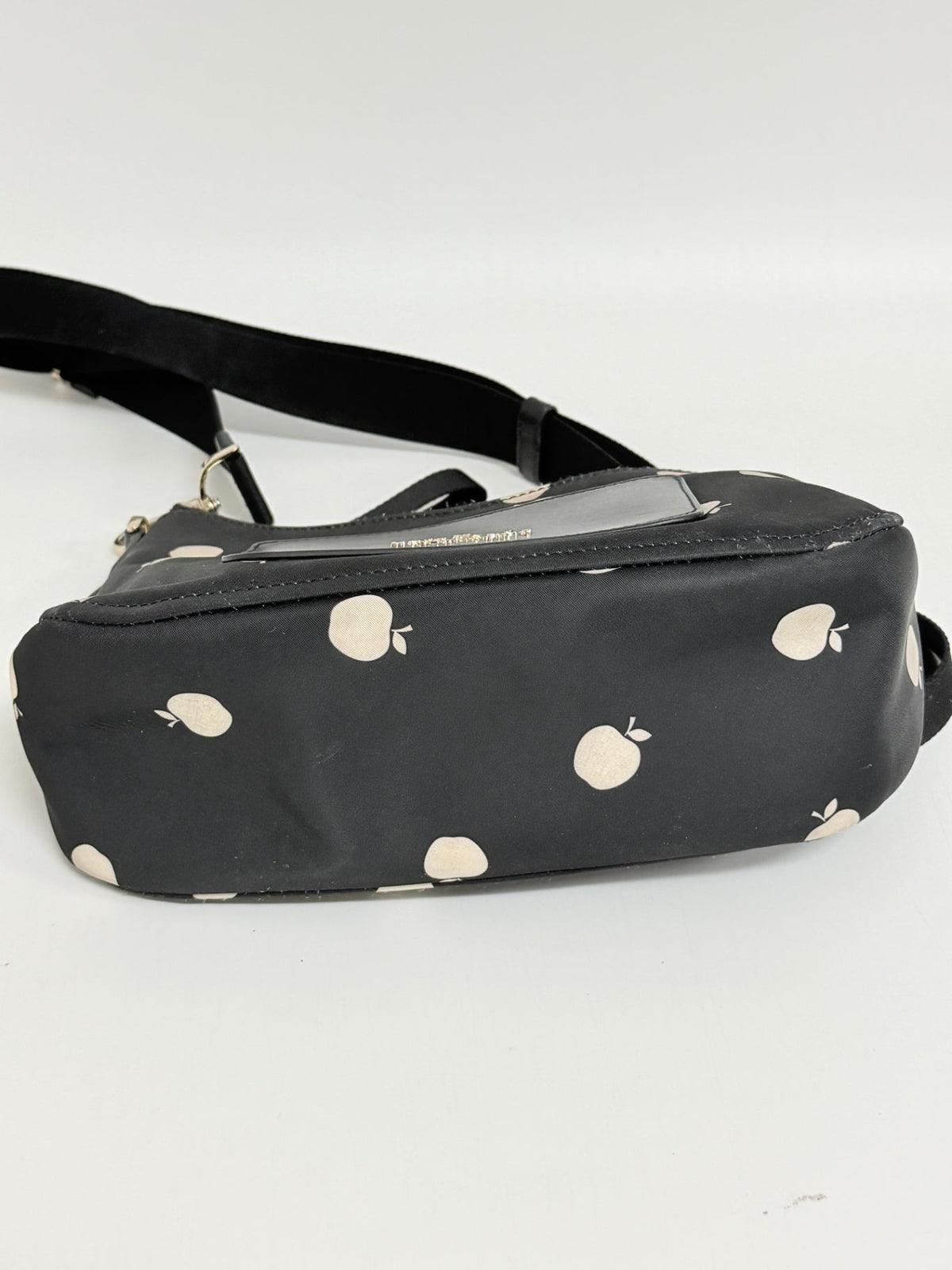 Lynn's Closet Boutique Kate Spade Chelsea nylon crossbody bag in black with a white apple print and adjustable strap