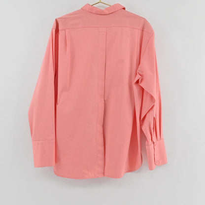 Lynn's Closet Boutique La Ligne coral button-down shirt with long sleeves and wide cuffs, back view.