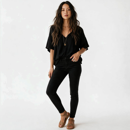 Lynn's Closet Boutique L'Agence Marguerite black skinny jeans worn by a model with a black v-neck top and sandals