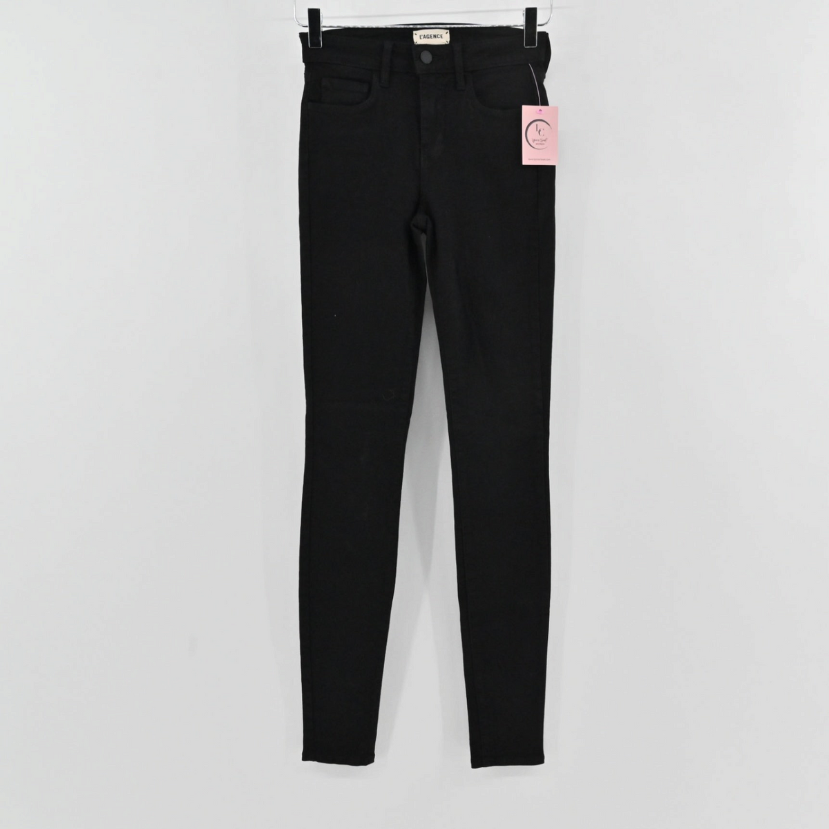 Lynn's Closet Boutique L'Agence Marguerite black skinny jeans with mid-rise fit and button-zip closure.