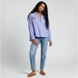 Lynn's Closet Boutique Anthropologie lavender popover blouse with eyelet embroidery worn by a model with blue jeans