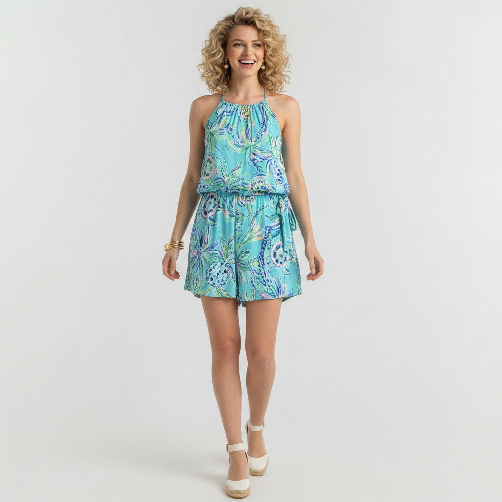 Lynn's Closet Boutique light blue floral print cotton blend romper with elastic waistband and spaghetti straps, size L.