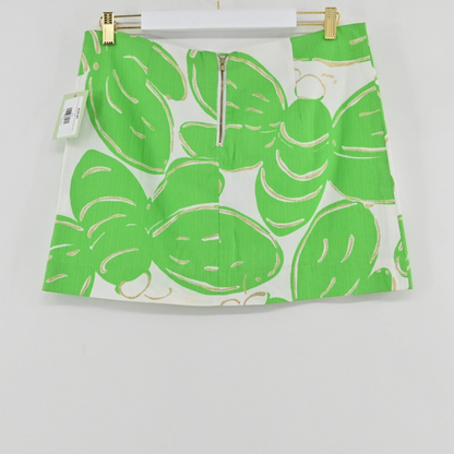 Lynn's Closet Boutique Lilly Pulitzer Tate mini skirt in white with a lime green bee-inspired print and back zipper.