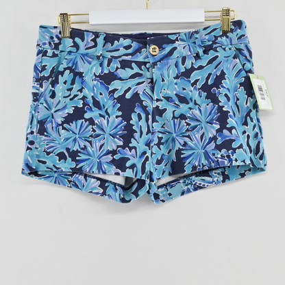 Lynn's Closet Boutique Lilly Pulitzer Callahan shorts in blue and teal tropical coral print hanging on a hanger