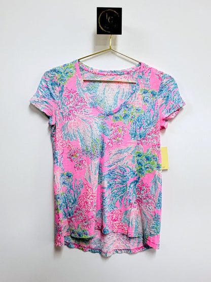 Lynn's Closet Boutique Lilly Pulitzer Etta V-neck tee in a vibrant pink, blue, and green tropical floral print.