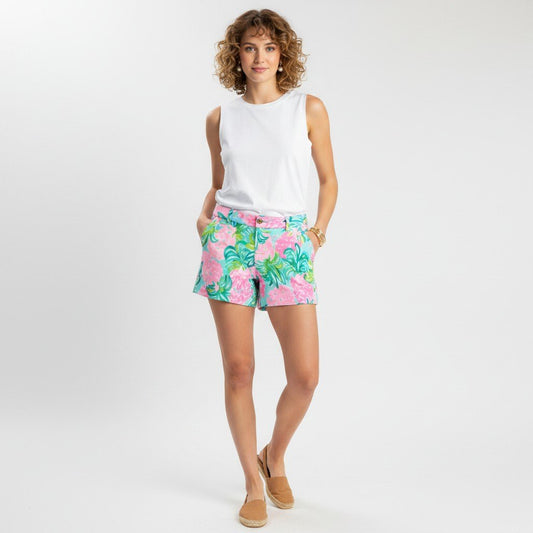 Model wearing Lynn's Closet Boutique Lilly Pulitzer Callahan shorts in pink and turquoise pineapple print with tank