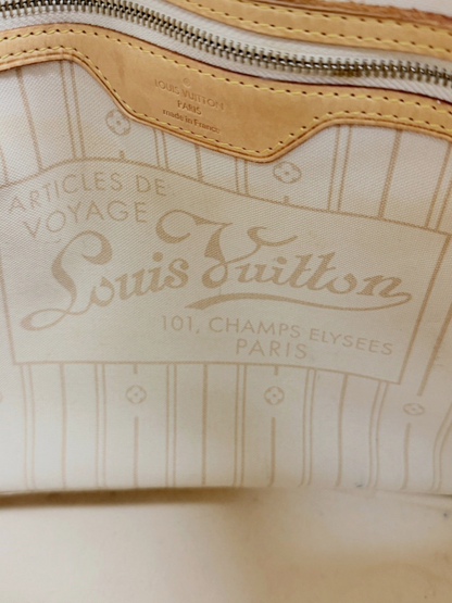 Interior of Lynn's Closet Boutique Louis Vuitton Neverfull MM showing the beige textile lining and leather logo patch