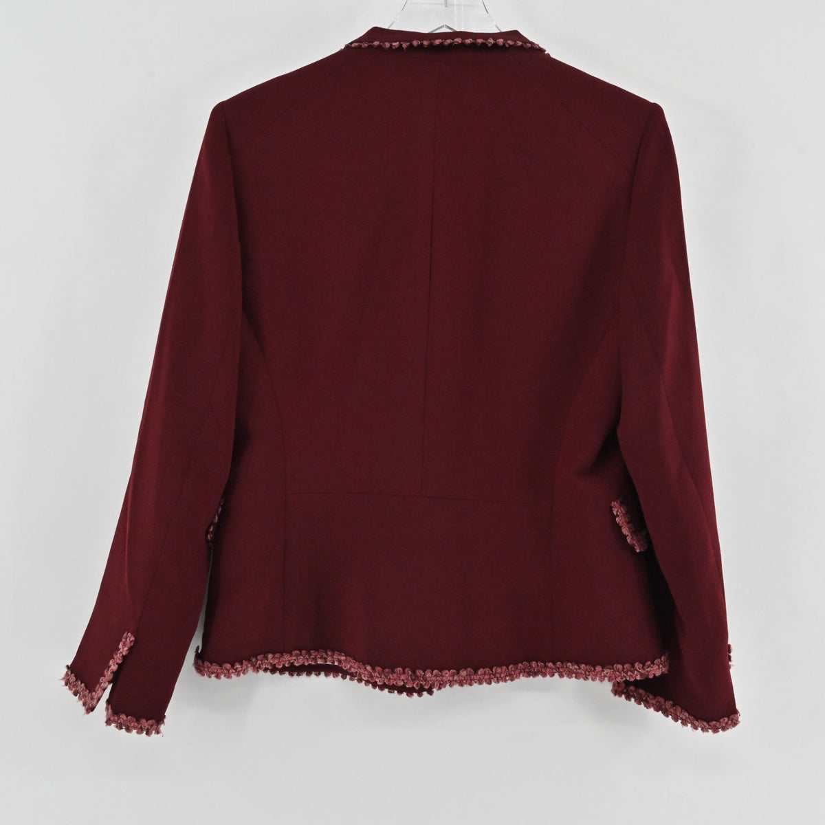 Back view of a Lynn's Closet Boutique maroon blazer with intricate crochet trim on the cuffs and hem.