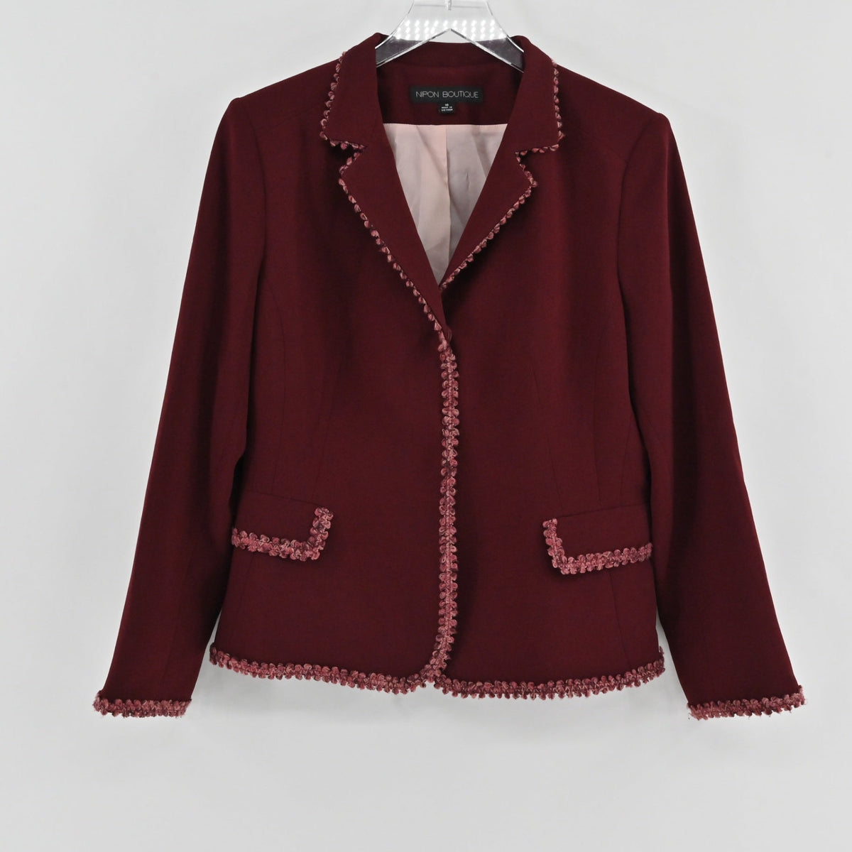 Lynn's Closet Boutique maroon Nipon Boutique blazer with crochet-style trim on lapels, pockets, and cuffs.