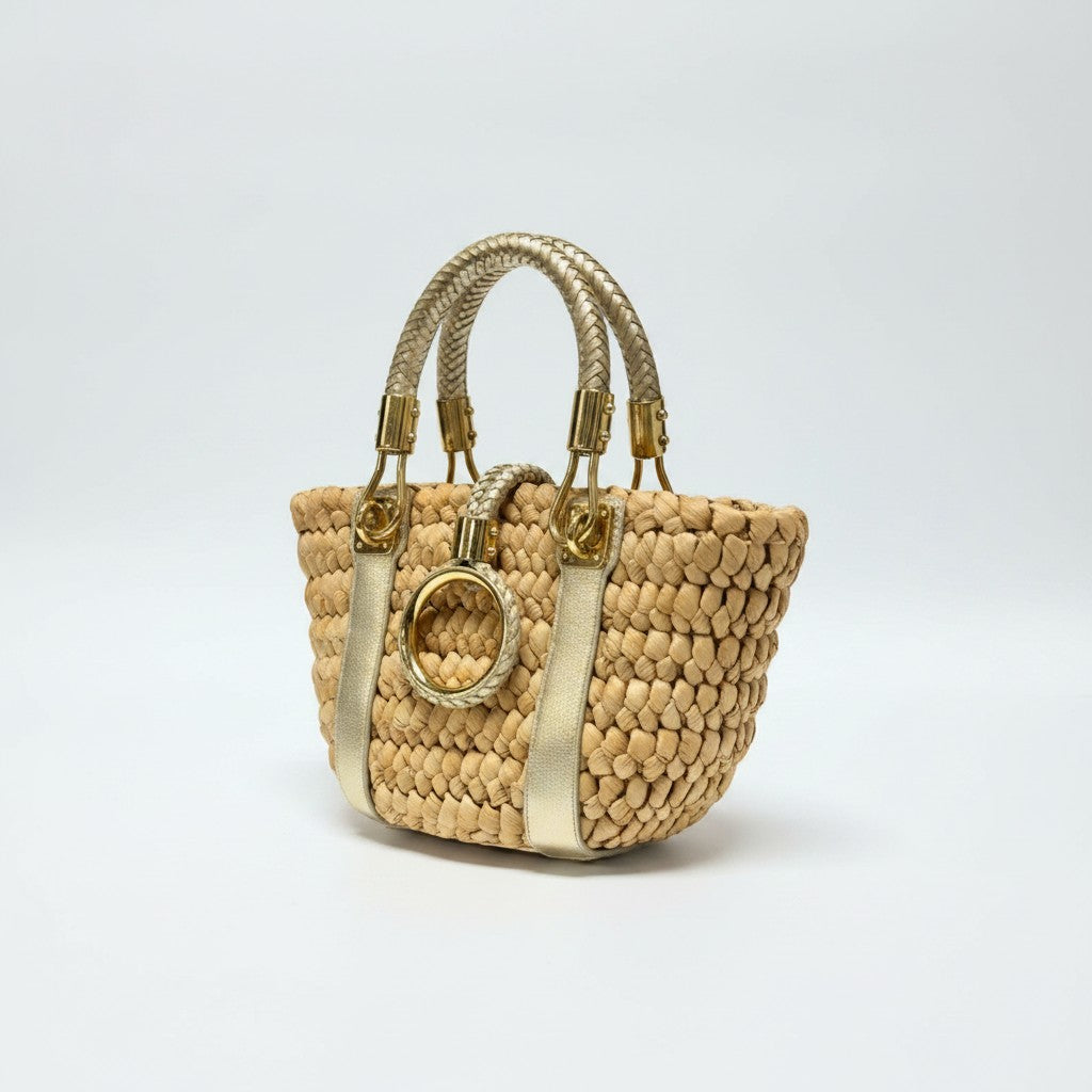 Lynn's Closet Boutique Michael Kors raffia tote bag with gold leather braided handles and central ring hardware.