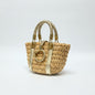Lynn's Closet Boutique Michael Kors raffia tote bag with gold leather braided handles and central ring hardware.