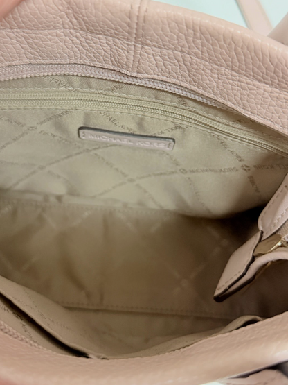 Interior of Lynn's Closet Boutique Michael Kors blush pebbled leather tote with logo lining and zippered pocket