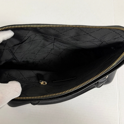 Interior view of Lynn's Closet Boutique Michael Kors black tote featuring signature fabric lining and zip pocket