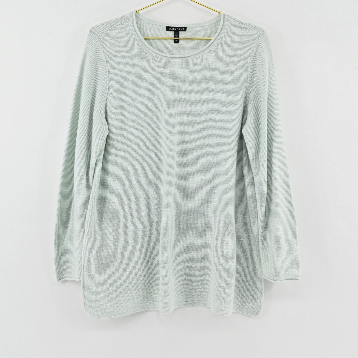 Lynn's Closet Boutique Eileen Fisher mint green textured crew neck sweater with long sleeves on a gold hanger