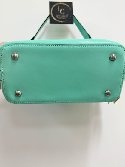 Lynn's Closet Boutique Patricia Nash Irving bucket bag base showing four protective metal feet in mint leather