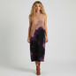 Lynn's Closet Boutique Misook sleeveless midi dress with abstract landscape print in tan, purple, and black on a model