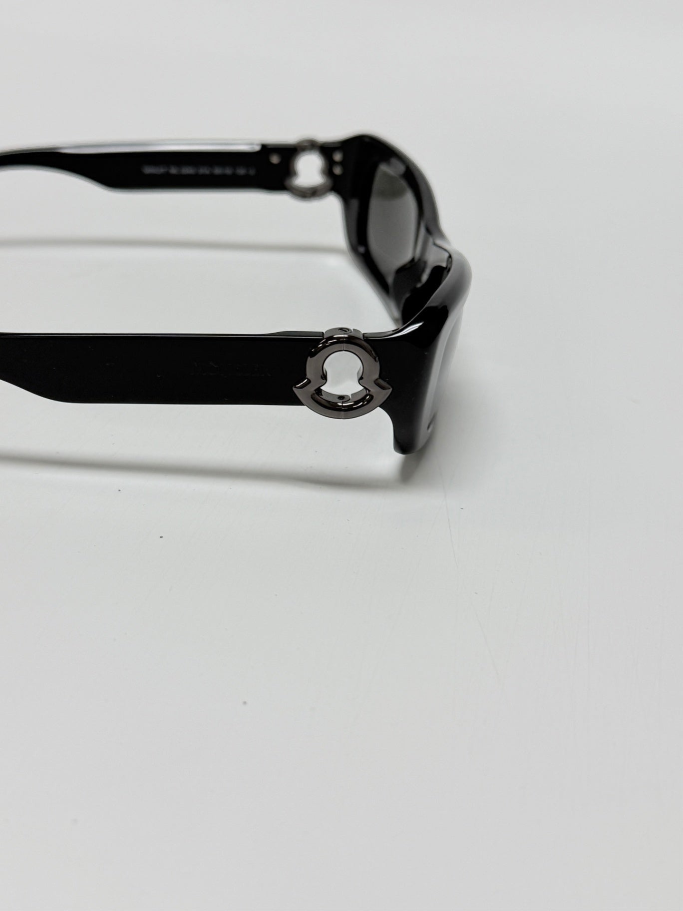 Lynn's Closet Boutique Moncler Minuit black acetate sunglasses featuring iconic logo hardware on the temple
