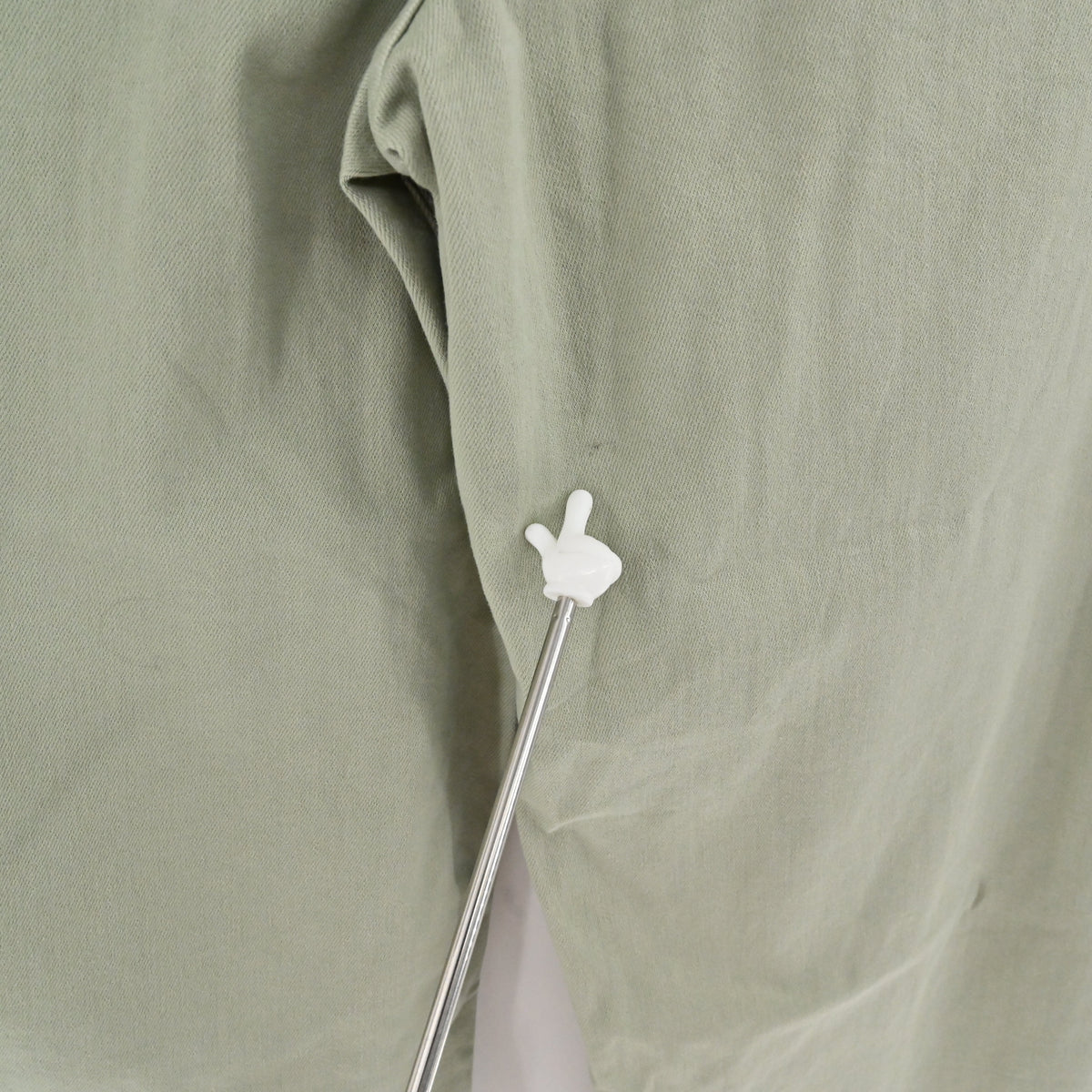 Lynn's Closet Boutique Anthropologie Maeve Colette moss green wide-leg pants showing a small fabric discoloration spot