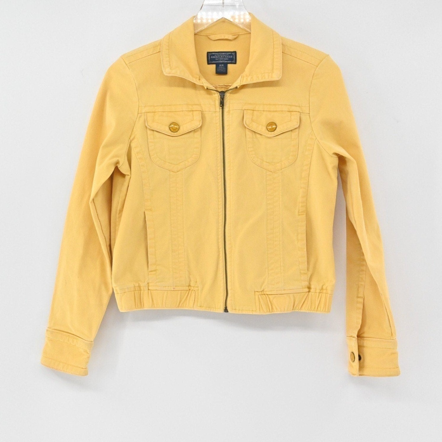 Lynn's Closet Boutique mustard yellow American Eagle zip-up trucker jacket with chest pockets and ribbed hem