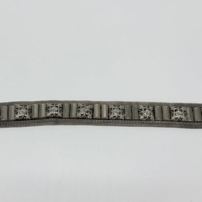 Lynn's Closet Boutique Nanni Italian metallic mesh belt with ornate engraved silver-tone hardware and decorative studs.