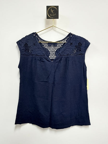 Lynn's Closet Boutique navy blue Lilly Pulitzer sleeveless top with intricate crochet yoke detailing on a hanger.