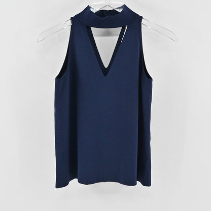 Lynn's Closet Boutique navy sleeveless knit top with a high-neck collar and a modern cutout detail at the chest.