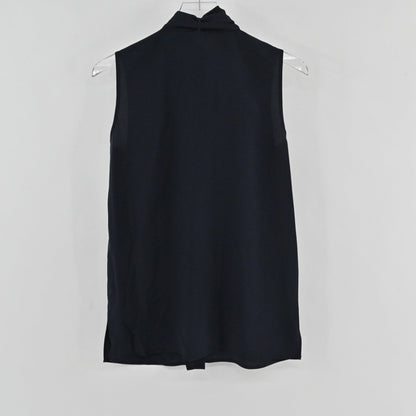 Lynn's Closet Boutique navy sleeveless Tory Burch top with a high tie-neck detail, shown from the back.