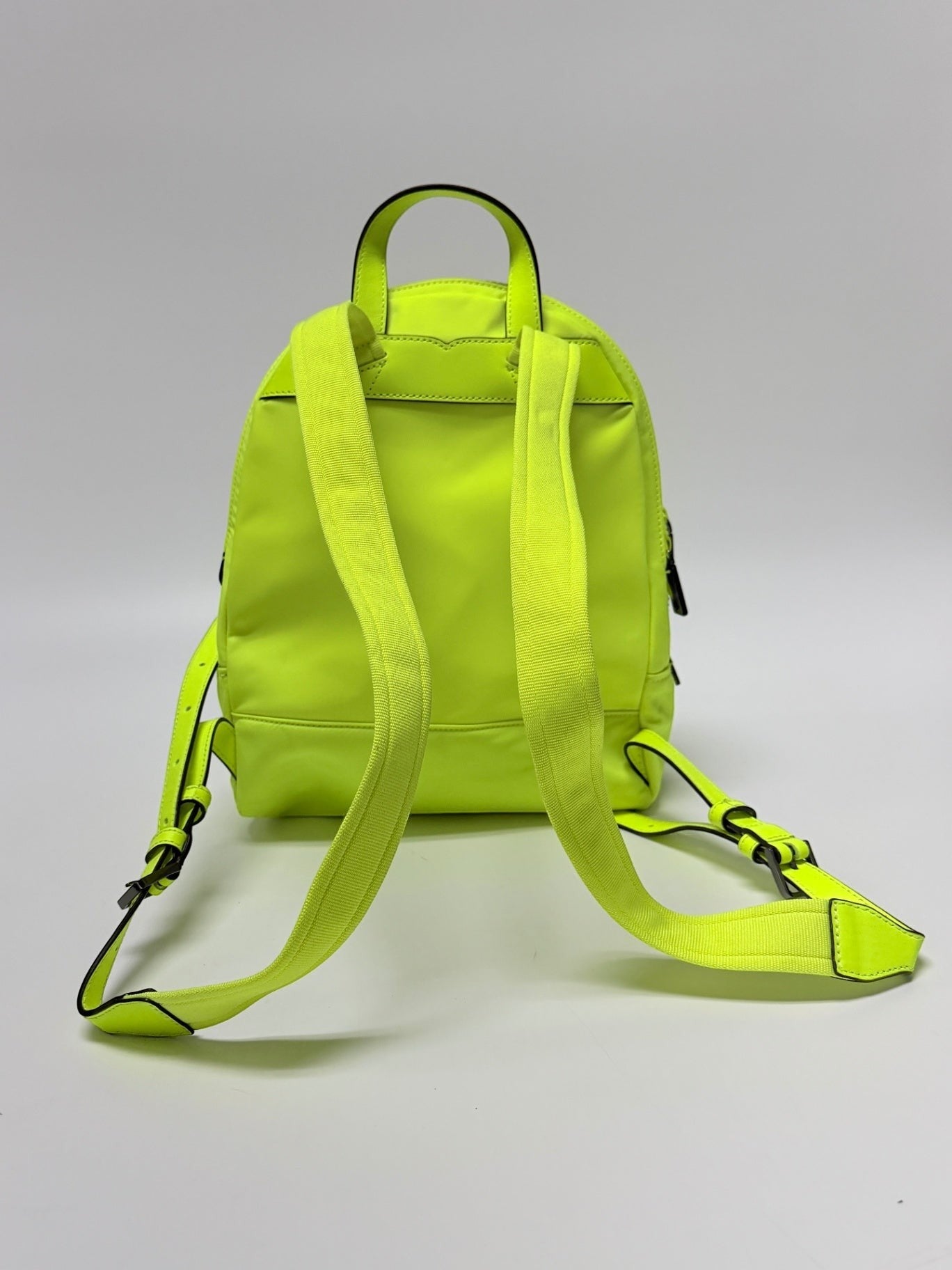 Lynn's Closet Boutique neon yellow Kate Spade Chelsea nylon backpack, back view with adjustable shoulder straps.