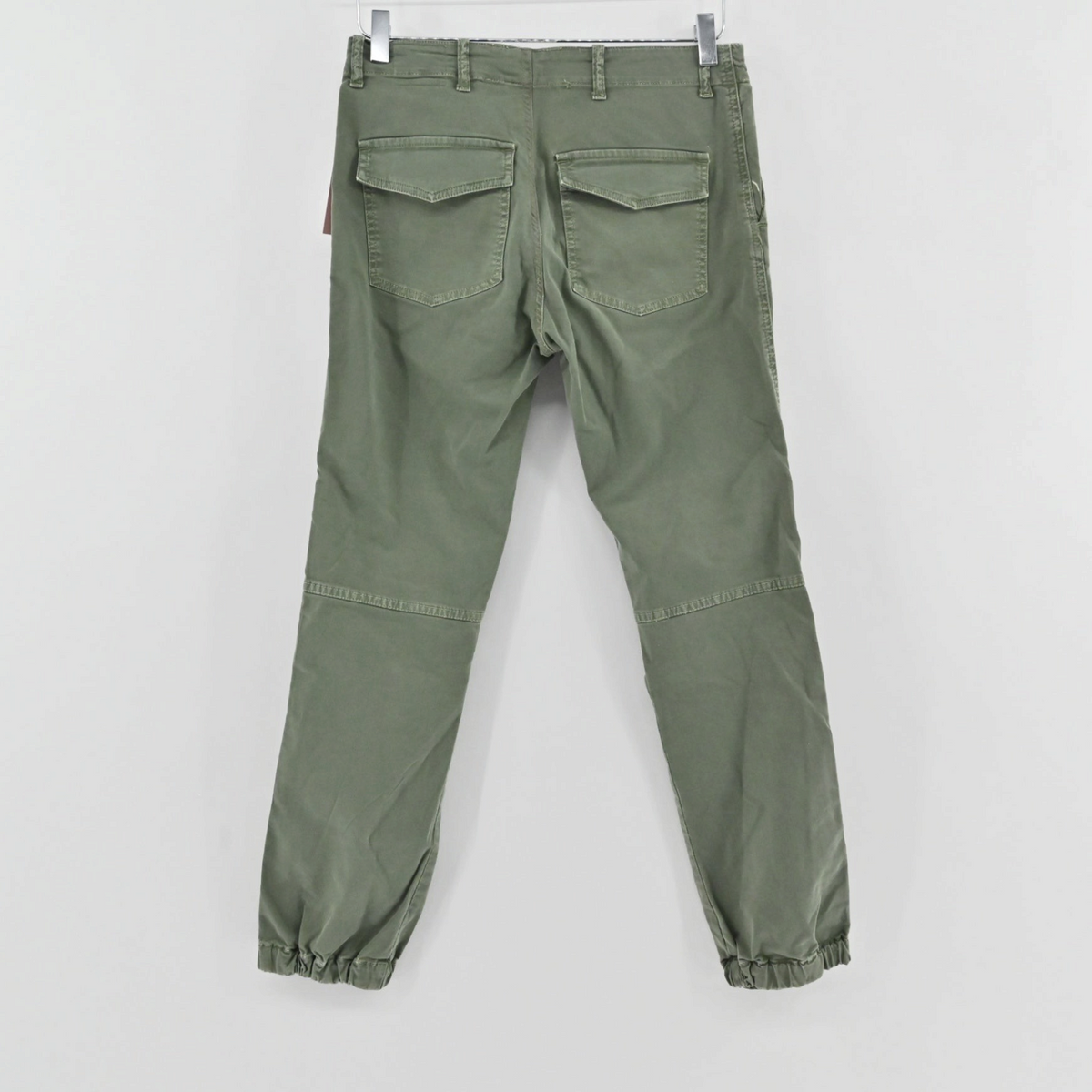 Lynn's Closet Boutique Nili Lotan olive green slim-fit utility pants with back flap pockets and elastic ankle cuffs.