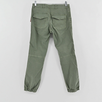 Lynn's Closet Boutique Nili Lotan olive green slim-fit utility pants with back flap pockets and elastic ankle cuffs.